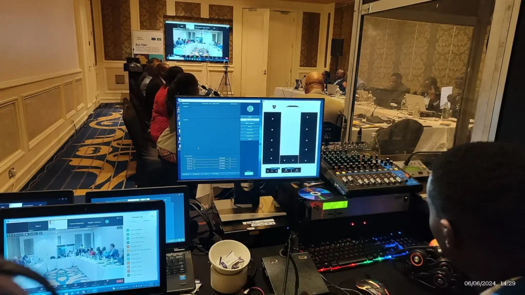 On-site audio technician managing frequency coordination at a Nairobi conference